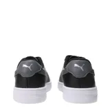 Championes Puma modelo Court Lally Feline, color negro con suela blanca y franja lateral con estampado animal print.