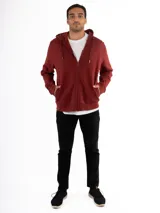 Campera canguro Kevingston de jersey frisado invisible de algodón, en color azul. Presenta cierre frontal completo, capucha con cordón ajustable y bolsillos delanteros amplios tipo canguro.