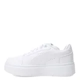 Championes Puma modelo Rebound Femme Low, con diseño de plataforma, cuerpo en color blanco con detalles en negro y gris claro. Presentan cierre con cordones y suela de goma robusta.