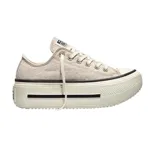 Championes Converse modelo Chuck Taylor Double Stack Ox, de corte bajo con plataforma elevada. Presentan capellada de lona en color beige, cordones al tono y suela de goma con franjas negras decorativas.