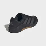 Championes de entrenamiento Adidas Dropset 4, color negro con detalles en gris oscuro y suela de goma en tono marrón. Diseñados para estabilidad en levantamiento de pesas y movimientos explosivos, cuentan con empeine de malla resistente y tecnología de retorno de energía.