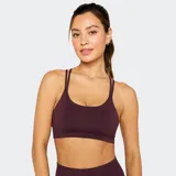 Top deportivo de bajo impacto en color azul marino, con escote redondo y diseño de doble bretel fino. Confeccionado en tejido técnico elástico, ideal para actividades de baja intensidad.