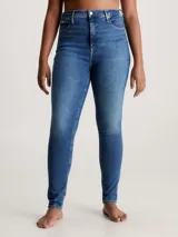 Jeans ajustados de tiro alto para mujer, en denim de algodón elástico con lavado azul medio vintage. Presentan diseño de cinco bolsillos y bragueta con cremallera.