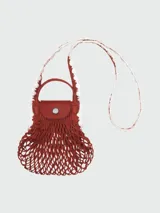 Bolso crossbody Longchamp modelo Le Pliage Xtra Filet Craft XS, de diseño tipo red en color terracota con detalles en cuero al tono, manijas cortas y correa larga ajustable.