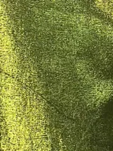 Pantalón de lino color naranja, de corte palazzo y tiro alto.