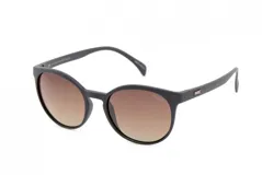 Lentes de sol MDQ modelo Balagan, con montura redonda negra y lentes degradadas marrones.