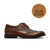 Zapato de vestir tipo brogue de cuero marrón, con cordones y suela de taco bajo.