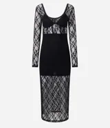 Vestido midi de encaje negro con mangas largas, escote en V estructurado y detalle de recorte tipo corset en el torso. La falda presenta un diseño con transparencia y caída fluida.