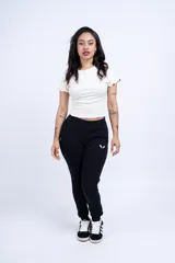 Pantalón de jogging negro de felpa con frisa, corte ajustado, cintura elástica con cordón de ajuste y logo bordado en el muslo izquierdo.