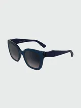 Lentes de sol Longchamp con armazón de acetato en color azul traslúcido y cristales degradados en tono oscuro.