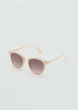 Gafas de sol Jeanne con montura de pasta color beige y puente metálico dorado. Lentes con degradé marrón y factor de protección UV categoría 3.