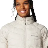 Campera acolchada Columbia modelo Powder Lite II, color beige, con cierre frontal completo, cuello alto con protección de barbilla y bolsillos laterales con cremallera. Cuenta con tecnología Omni-Heat™ termorreflectante y aislamiento sintético Thermarator™.