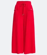 Pantalón pantacourt verde oliva de cintura alta con elástico, bolsillos laterales y lazo ajustable en la cintura.