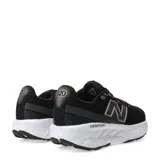 Championes de running New Balance modelo Fresh Foam 520, color negro con detalles en rosa dorado (logo 'N' y detalles en la parte trasera). Poseen entresuela blanca con tecnología Fresh Foam y suela exterior negra.