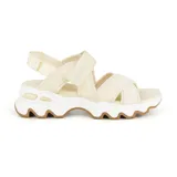 Sandalias Skechers Big Lug color beige con tiras cruzadas de nylon, malla y neopreno, ajuste con velcro en tobillo y empeine, plantilla acolchada Yoga Foam, entresuela gruesa articulada y suela de tracción flexible.