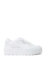 Championes de plataforma Puma modelo Karmen II Idol, con diseño en blanco, negro y franja lateral celeste.