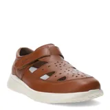 Sandalias tipo cerradas de cuero color marrón coñac, con diseño troquelado en la parte superior, cierre de velcro lateral y suela de goma blanca.