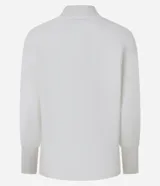 Blusa de punto acanalado color tostado, con cuello alto, mangas largas y puños ajustados. Confeccionada en viscosa, poliéster y poliamida.