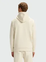 Buzo con capucha Boss modelo Soody Zone, color beige claro, con logo de la marca estampado en negro en el pecho y cordones ajustables en la capucha.