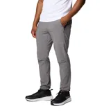 Pantalón gris Columbia modelo Triple Canyon P Ii, con tecnología Omni-Shade y Omni-Shield, diseñado para senderismo. Cuenta con bolsillos con cremallera y puños ajustables.