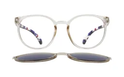 Anteojos de acetato transparentes con forma redonda y patillas estampadas. Incluyen clip-on polarizado color gris.