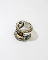 Anillo de plata 925 con doble banda, dublé de oro y zirconias azules y blancas.