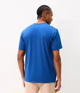 Remera deportiva Get Over de color azul, con tecnología dry, cuello redondo, manga corta y estampa frontal localizada con el texto "Heritage".