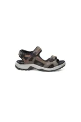 Sandalias de cuero color marrón con ajuste de velcro en el tobillo y en la parte delantera del pie.