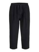 Pantalón gris oscuro de corte holgado, con pinzas en la cintura y estilo relaxed.