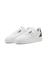 Championes Puma Shuffle Downtown, color blanco con detalles en negro y dorado.