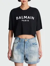 Remera corta negra de algodón con logo Balmain Paris estampado en blanco.