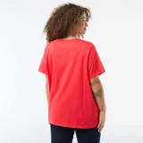 Camiseta básica de manga corta con cuello en pico, confeccionada en algodón, de corte holgado y diseño liso.