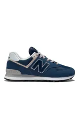 Championes New Balance modelo ML574EVN, color azul marino con detalles en gris y blanco, confeccionados en gamuza y malla, con el característico logo "N" en los laterales y entresuela ENCAP.