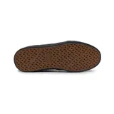 Championes Etnies modelo Barge LS de color negro, con diseño de perfil bajo, suela blanca y detalles en lona y gamuza.