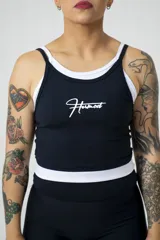 Musculosa deportiva negra con doble tela y logo Hermod estampado en blanco.