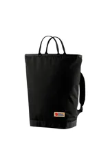 Mochila tipo tote bag Fjallraven Vardag, color negro, con asas superiores y correas de hombro ajustables. Presenta el logo de la marca en un parche rectangular en la parte inferior frontal.