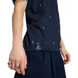 Camiseta de fútbol Adidas de la selección de Alemania, modelo Away. Diseño en color azul marino con patrón sutil de rombos, detalles en verde agua y blanco en cuello y mangas, logo de Adidas Originals y escudo de la federación alemana.