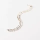 Pulsera de plata 925 con diseño de eslabones tipo Bismark, caracterizada por su estructura plana y entrelazada que ofrece un acabado brillante y sofisticado.