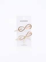 Set de dos broches dorados para el pelo: uno con forma de moño y otro con forma de infinito.