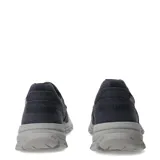 Zapatos tipo slip-on Caterpillar modelo Threshold, confeccionados en lona resistente color azul marino. Presentan un diseño de estilo casual con costuras reforzadas, elásticos laterales para un calce fácil y una suela de goma robusta en color gris con el logo de la marca en la puntera.