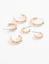 Set de tres pares de aros tipo argolla gruesa (bold), en tono dorado. Los aros vienen en tres tamaños diferentes: pequeños, medianos y grandes.