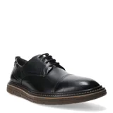 Zapato de vestir acordonado color negro, con puntera reforzada y suela de goma en tono marrón con detalle de costura visible.