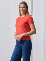 Buzo tejido en hilado fino color naranja, marca Ninety.