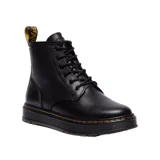 Botas de caña media Dr. Martens modelo Brookline, confeccionadas en cuero negro con acabado ceroso. Presentan cierre de cordones con seis ojales, suela gruesa con costuras amarillas visibles y tirador característico en el talón.