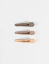 Set de tres horquillas para el pelo de diseño minimalista, con acabado mate en tonos tierra degradados.