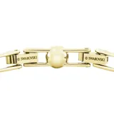Pulsera dorada con cristales blancos redondos engarzados en cristal pavé transparente.