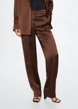 Pantalón de vestir de corte recto y tejido satinado fluido. Presenta una cintura elástica sin cierre y un diseño elegante de estilo traje.