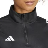 Buzo deportivo Adidas Tiro 24 negro con cierre de media cremallera, cuello alto y mangas largas. Presenta las tres tiras características de la marca en color blanco a lo largo de los hombros y las mangas.