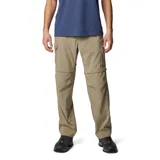Pantalón de senderismo convertible en short, color beige, con múltiples bolsillos cargo y cierre de cremallera en las rodillas. Cuenta con tecnología de protección solar y tejido de secado rápido.