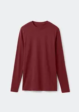Camiseta básica de manga larga con cuello redondo, confeccionada en tejido de algodón liso.